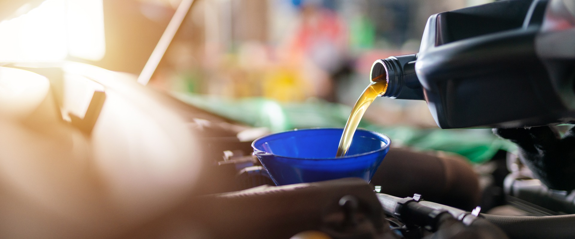 Auomobile repair, Refueling and pouring oil quality into the engine motor car Transmission and Maintenance Gear. Concept of quality engine oil.
